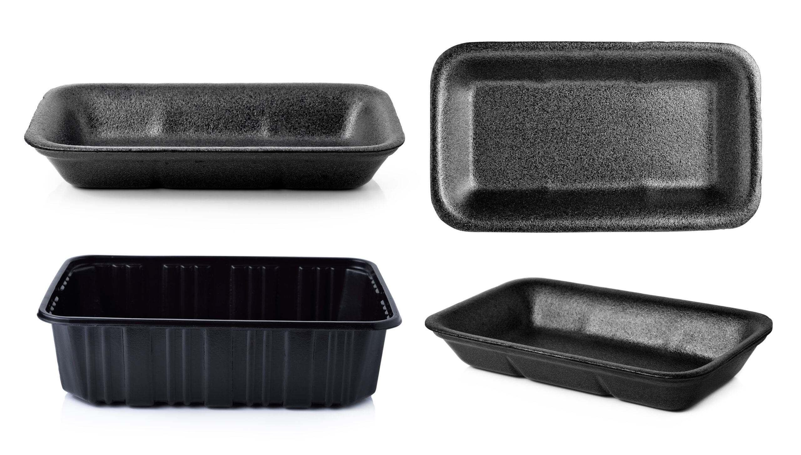 Assorted black plastic food containers and trays on a white background, in rectangular and oval shapes