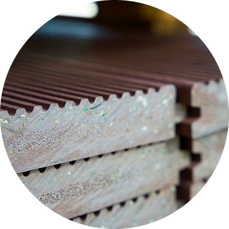 Vector 1-wood | Reedy Chemical Foam Stack of weathered brown wooden planks with tongue-and-groove edges piled together in a workshop or lumber yard.