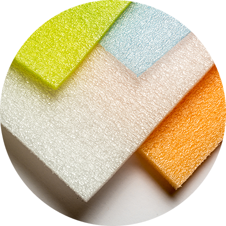 Vector 2-foam | Reedy Chemical Foam Set of layered foam scrubbing pads in lime green, light blue, white, and orange on a white surface.