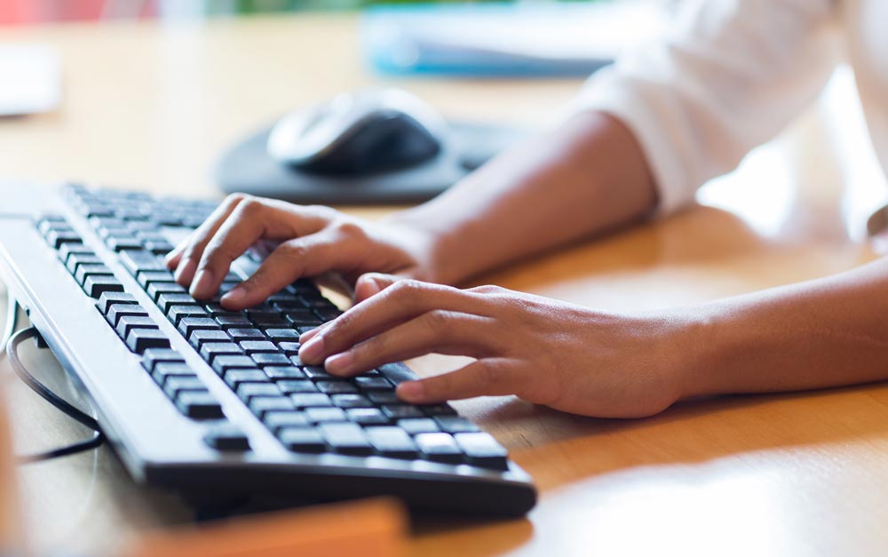 Hands-typing-keyboard | Reedy Chemical Foam Hands type on a black keyboard